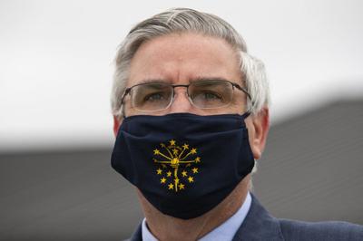 Gov. Eric Holcomb wearing mask with Indiana logo - 4-30-20-AP.jpeg