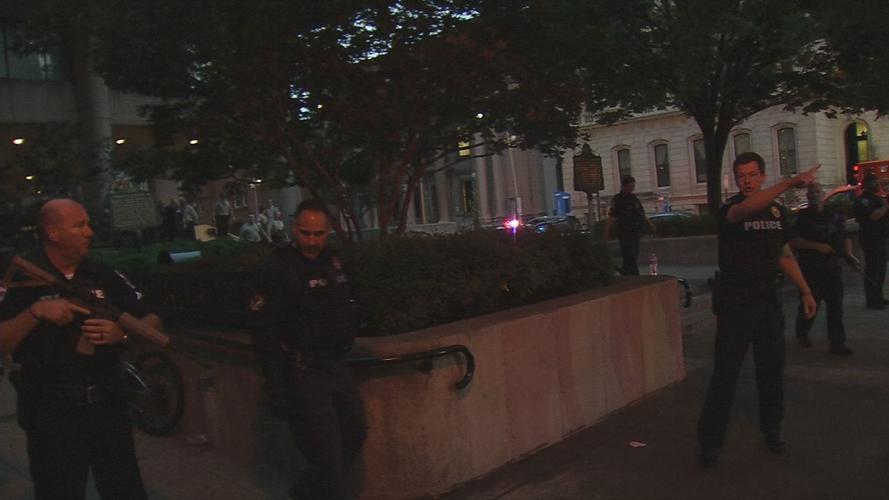 Downtown shooting police gun pointing.jpg