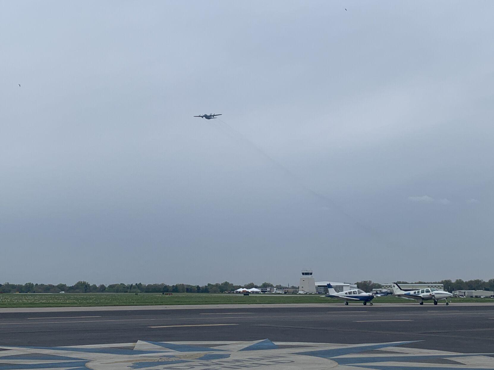 A plane flies over Bowman Field during Thunder Over Louisville airshow