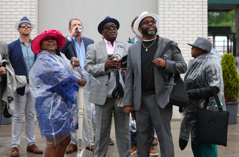 Group of men watch race at Churchill Downs.JPG