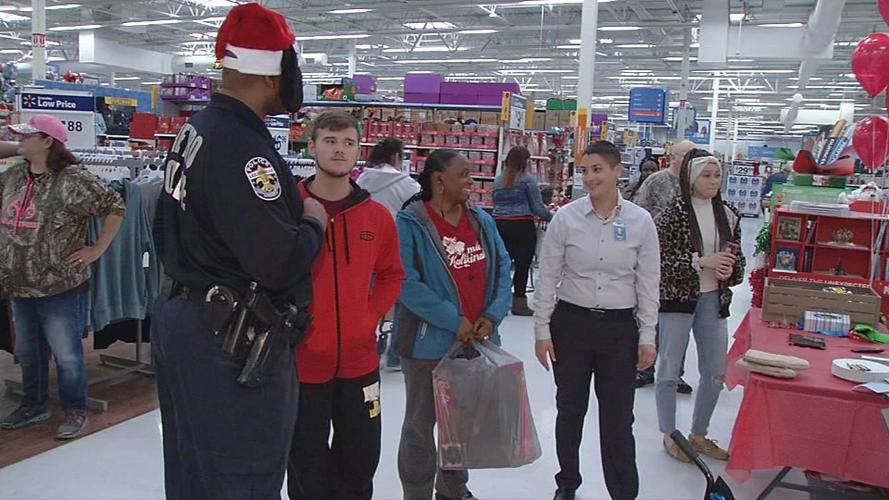 Metro Police Officers surprise Walmart shoppers with gift cards