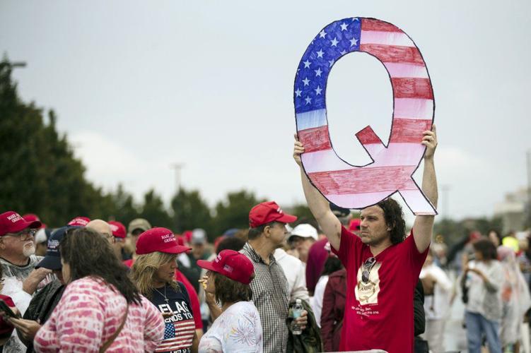 QAnon Q sign campaign rally, Donald Trump, conspiracy theories