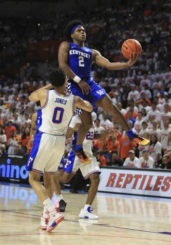 Kentucky guard Sahvir Wheeler makes a layup past Florida guard Myreon Jones.jpeg
