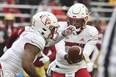 Louisville quarterback Malik Cunningham hands off the ball.jpeg