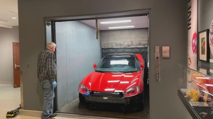 C6 Corvette loaded into elevator at Frazier History Museum