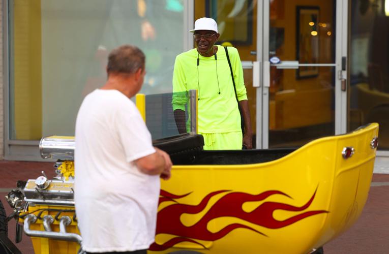 Street Rods are viewed by two men.JPG