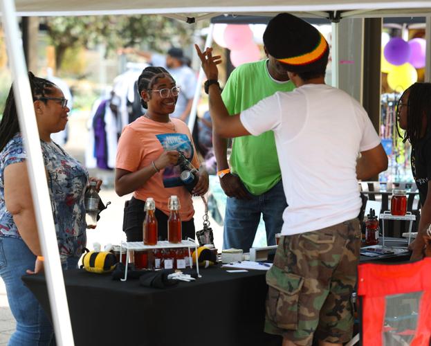 Person looks at vendors at Juneteenth Festival.JPG