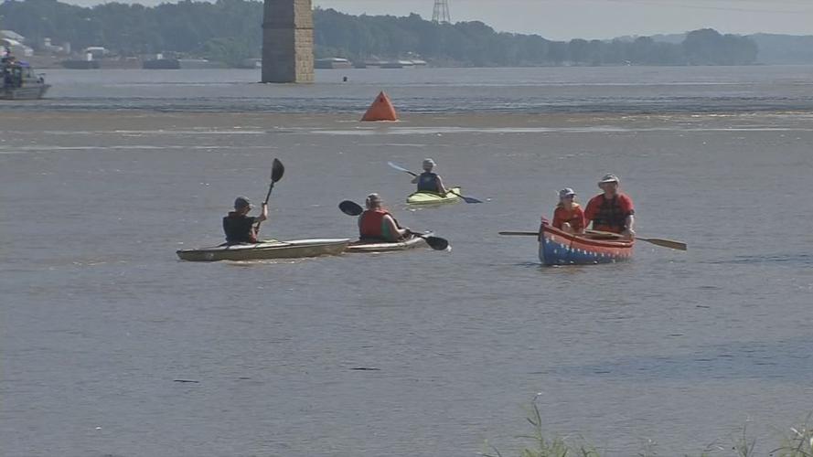 Hike, Bike and Paddle participants paddle down Ohio River