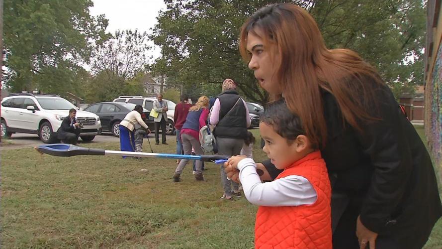 Immigrants performing a service project at Americana Community Center