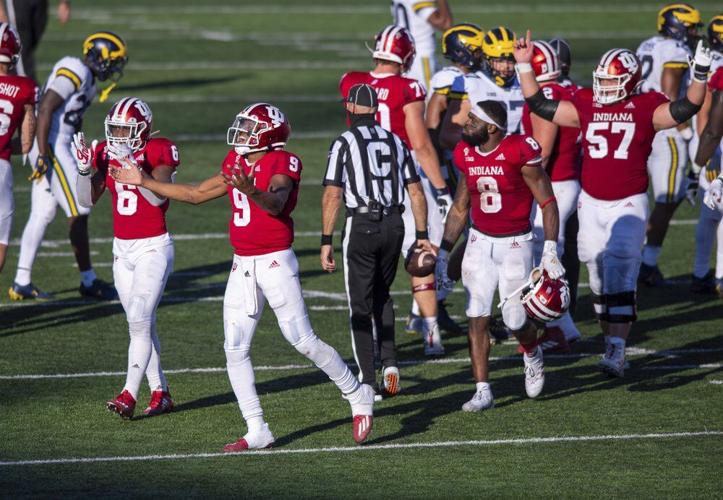 Indiana quarterback Michael Penix Jr. (9) and his teammates react