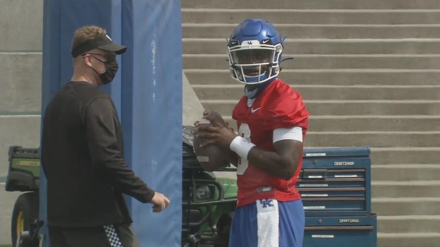 Former Kentucky coach Darin Hinshaw watches Terry Wilson during practice