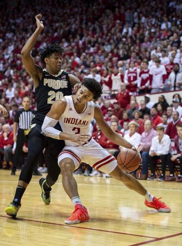 Indiana forward Justin Smith (3) makes contact with Purdue guard Nojel Eastern
