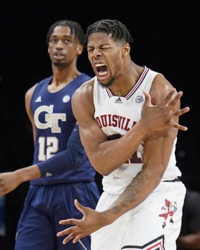 Louisville's Sydney Curry reacts after scoring alongside Georgia Tech's Khalid Moore.jpeg