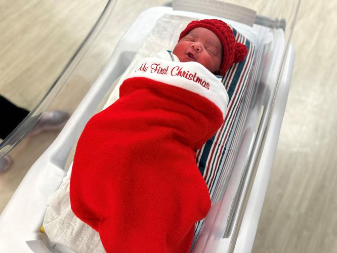 Baptist Health newborn in Christmas stocking