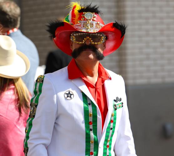 Man with mustache walks at Oaks.JPG