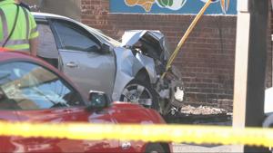 1 dead, 2 injured after car crashes into building on Logan Street