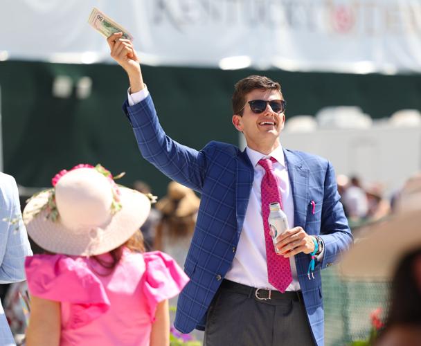 Man waves cash on Oaks
