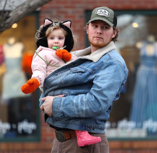 Man holds girl at St. Patrick's Day Parade.JPG