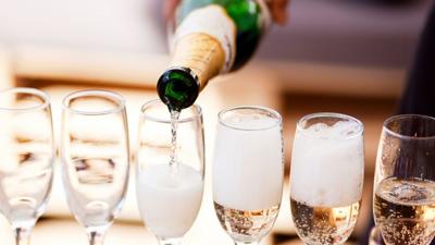Champagne Poured into Glasses