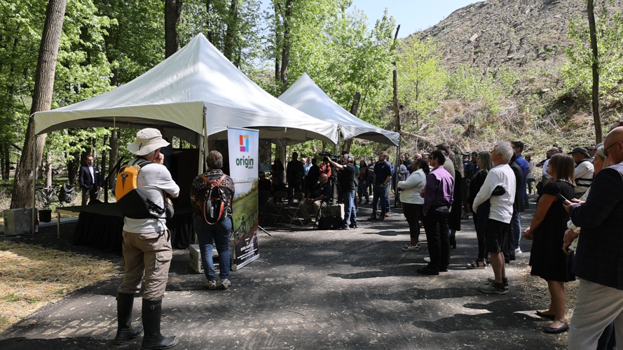 People listen to speaks at ceremony