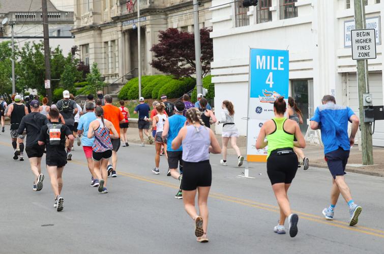 Runners pass by Mile 4.JPG
