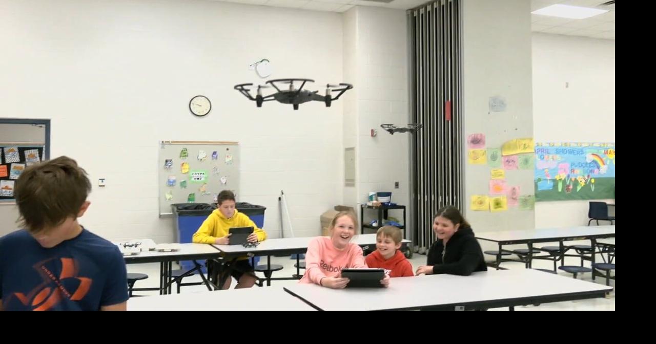 Buckner Elementary School students fly drones through cafeteria after learning in STEM class