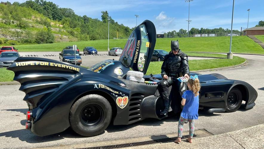 John Buckland, the 'West Virginia Batman' shows up to help kids affected by eastern Kentucky flooding