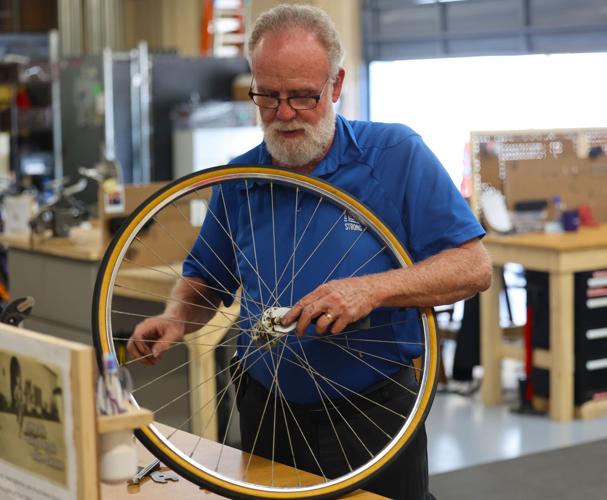 Glenn Todd fixes a bicycle.JPG