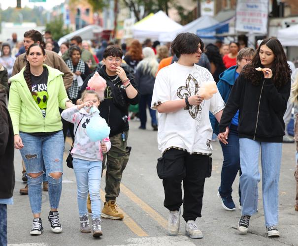 Group eats cotton candy at Harvest Homecoming.JPG