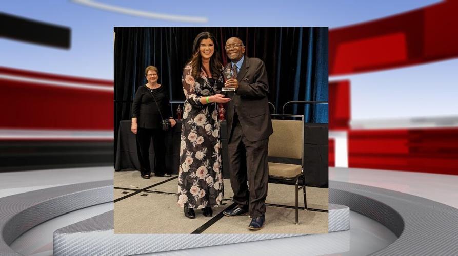 Amanda Roberts receives an award.jpg