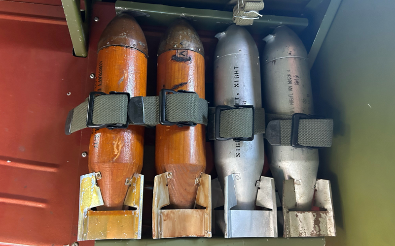 D-Day Anniversary: Munitions loaded on B-25 bomber at Bowman Field in Louisville, Ky.