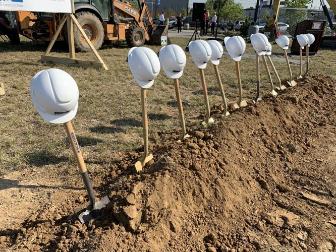 JCPS west broadway groundbreaking hard hats.jpg