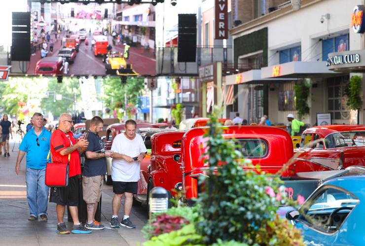 Group looks at Street Rods.JPG