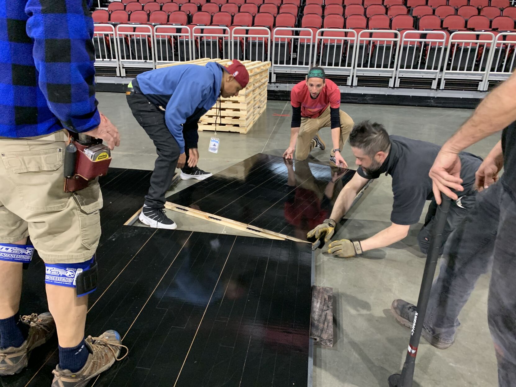 NCAA FLOOR  BEING INSTALLED AT YUM CENTER 3-21-2023 (19).JPG