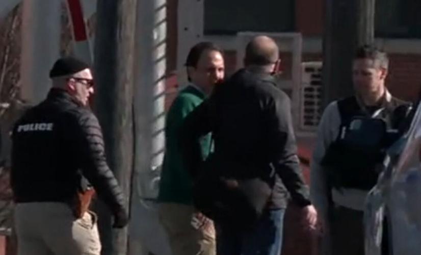 Louisville mayoral candidate Craig Greenberg speaks with police after shots fired at his office on Feb. 14, 2022
