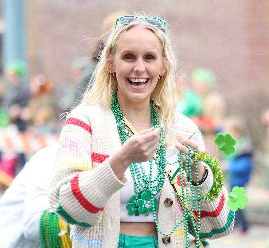 Woman smiles at St. Patrick's Day parade