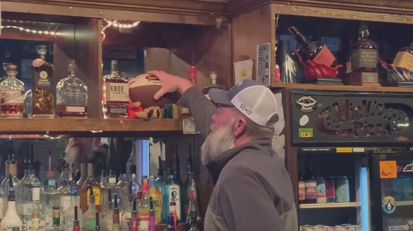 reaching for football