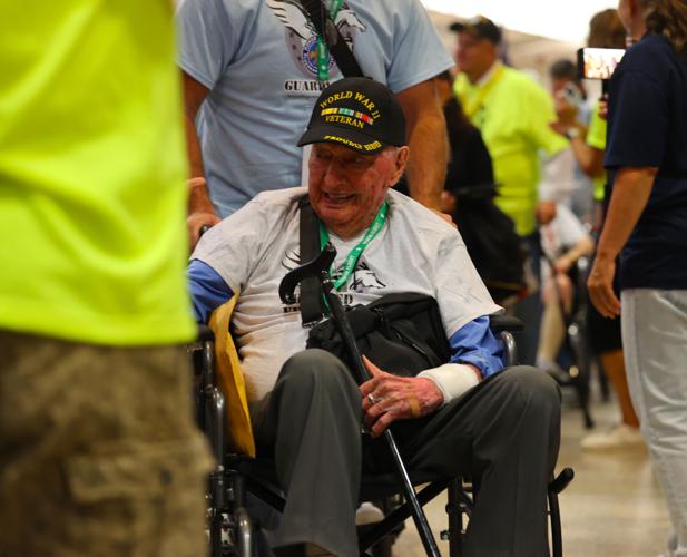 World War II veteran greets crowd at Honor Flight Return Home.JPG