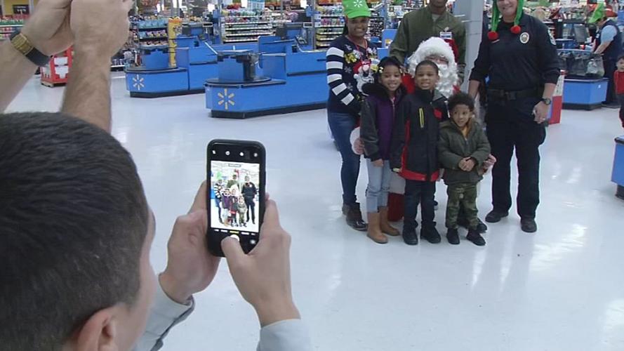 Metro Police Officers surprise Walmart shoppers with gift cards