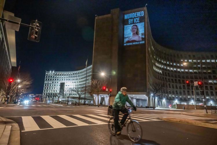 Activists Project Message Condemning ICE After Killing of Minneapolis Woman