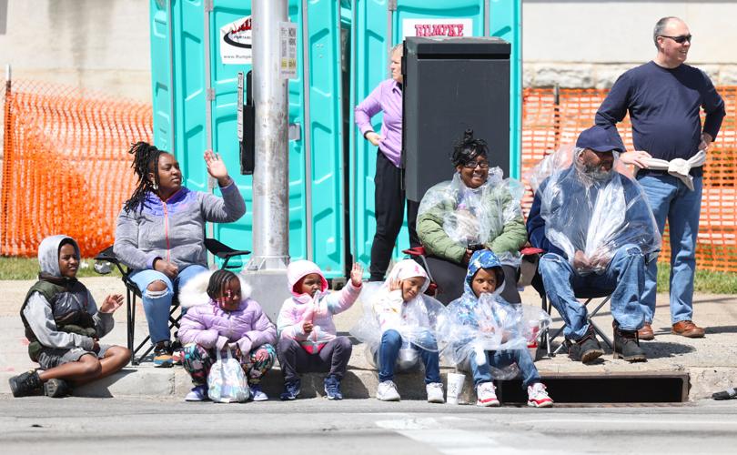 Crowd waves to floats at parade.JPG