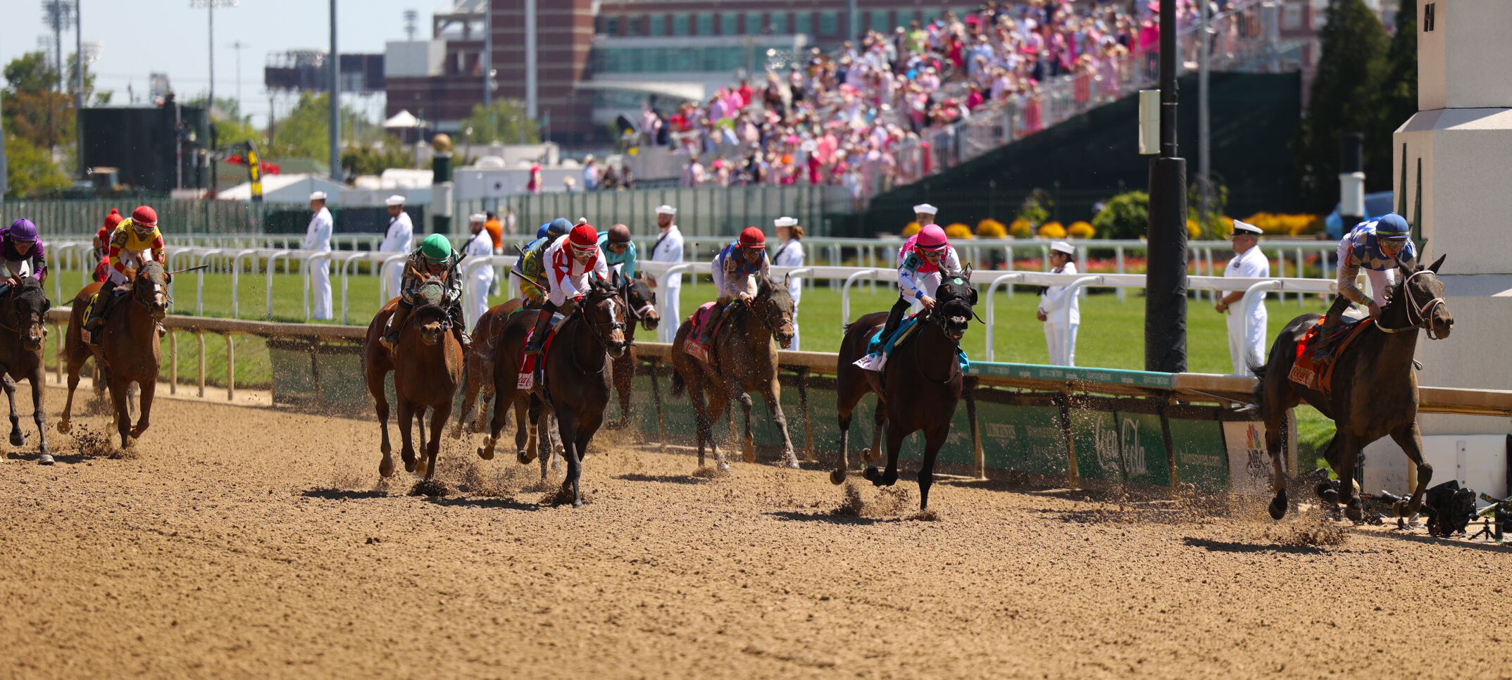 Horses near finish line at race.JPG
