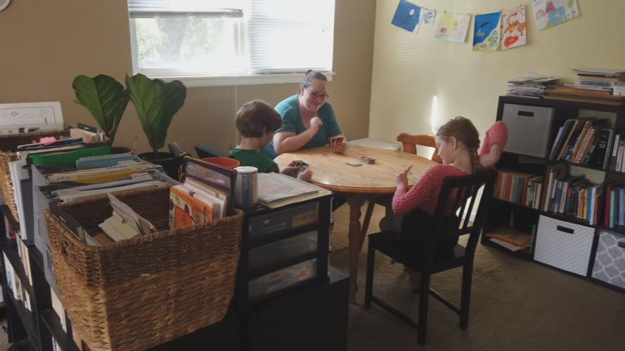 Highview family plays cards at home