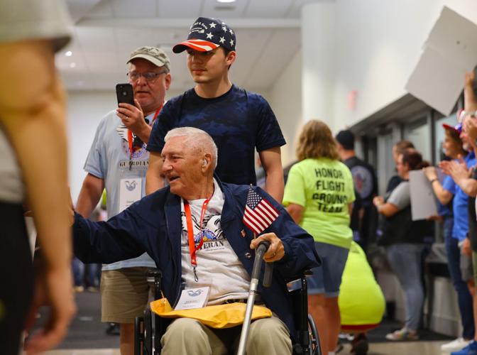 Veteran shakes hands at Honor Flight Return Home before leaving.JPG