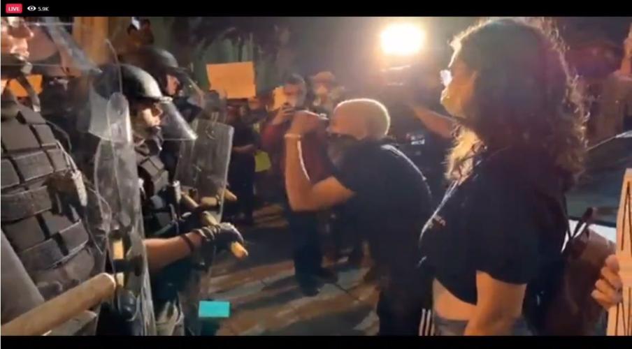 Protesters in downtown Louisville confront Louisville Metro Police Department