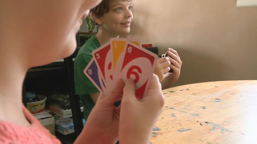 Highview family plays card game at home