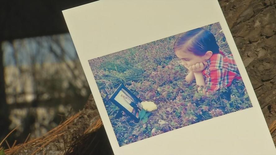 Fambrough’s son looking at photo