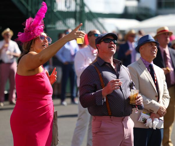 People watch video board at Churchill Downs.JPG