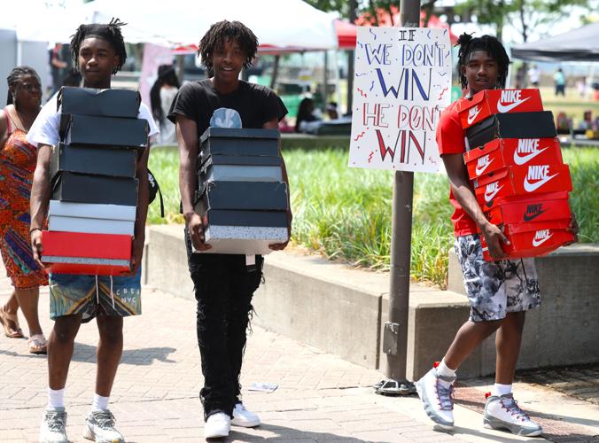 Boys carry shoes at Juneteenth Festival.JPG