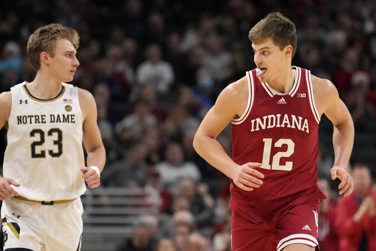 Indiana forward Miller Kopp reacts in front of Notre Dame guard Dane Goodwin.jpeg
